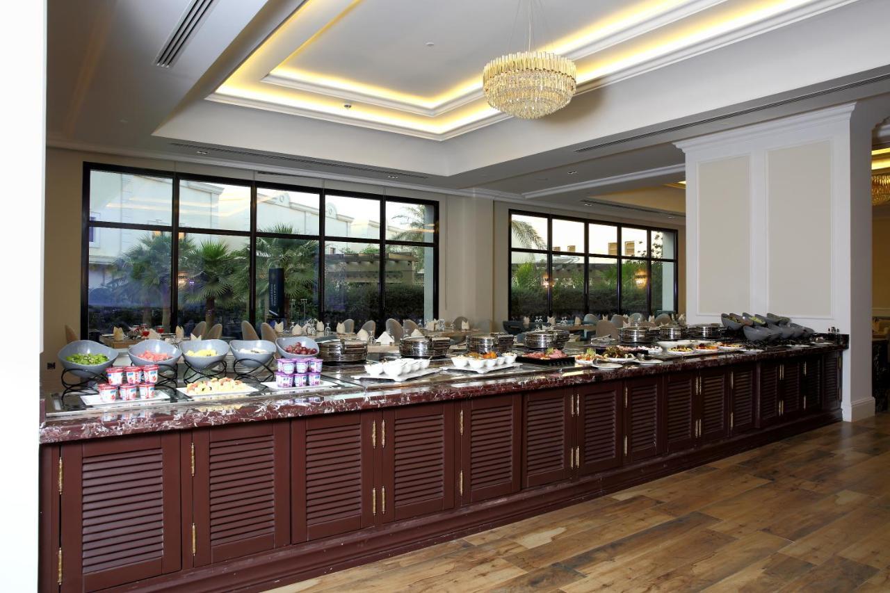 Vittori Palace Hotel And Residences Riyadh Exterior photo A buffet at a hotel