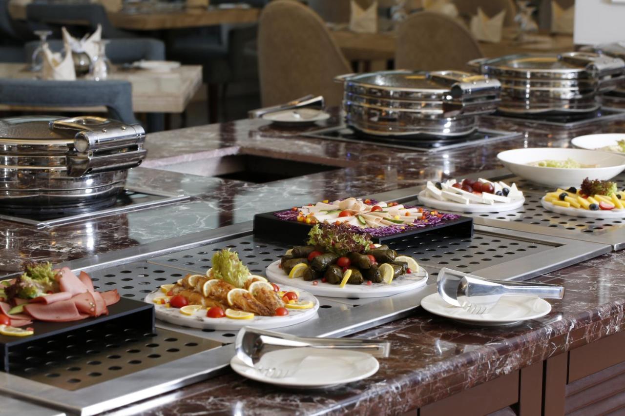 Vittori Palace Hotel And Residences Riyadh Exterior photo A buffet at a hotel